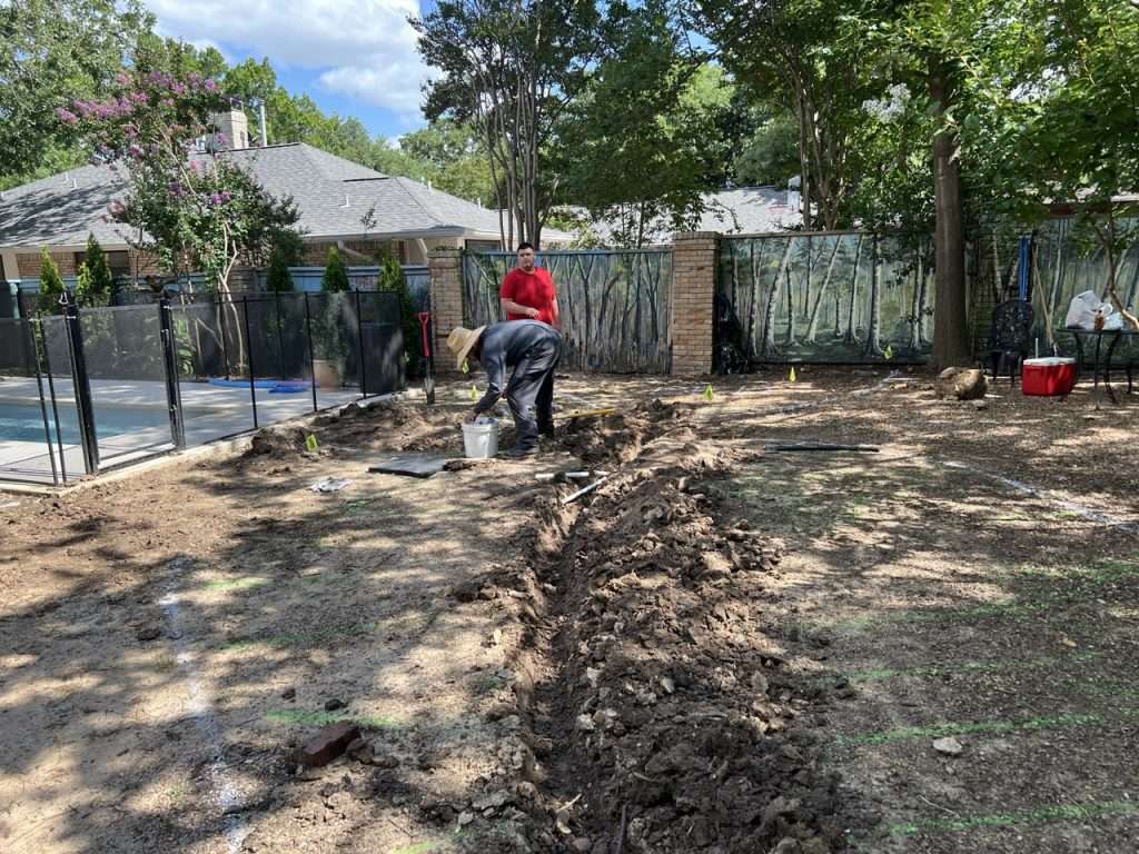 Irrigation piping installed beneath new Dallas backyard landscape